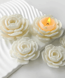 Realistic flower-shaped candles made using a silicone mould, shown with white and yellow wax finishes